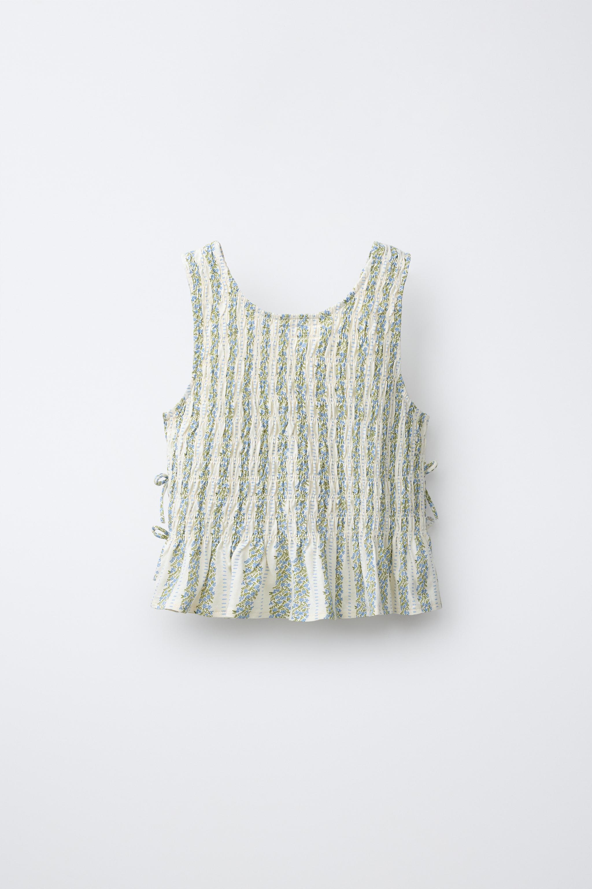 ELASTICIZED TIE TOP